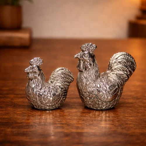 Polished silver rooster figurines